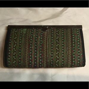 Hand stitched clutch